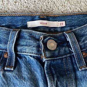 Levi’s wedgie fit distressed jeans